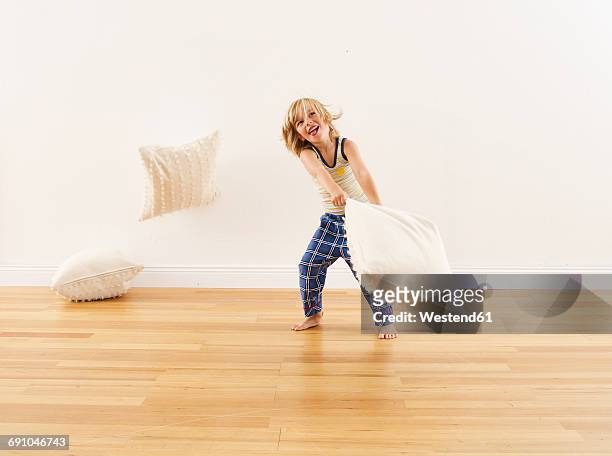 little boy having pillow fight with himself - pillow fight stock pictures, royalty-free photos & images