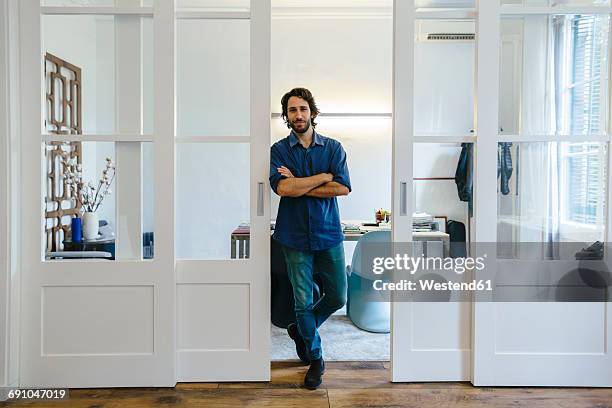 confident businessman standing in office - one man only stock pictures, royalty-free photos & images