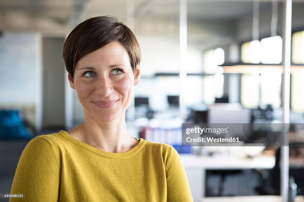 Portrait of smiling businesswoman in office