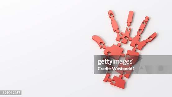 Dissolving red puzzle hand Dissolving red puzzle hand