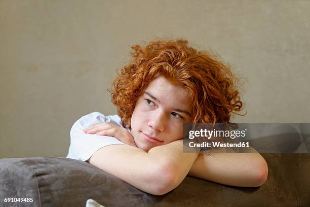 portrait of pensive redheaded teenage boy - redhead boy fotografías e imágenes de stock