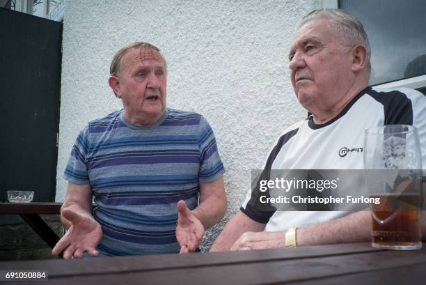 Regulars at the Chaddesden Park Social Club, Jim Agnew and Thomas McMillan, enjoy an afternoon pint and chat politics on May 31, 2017 in Derby,...