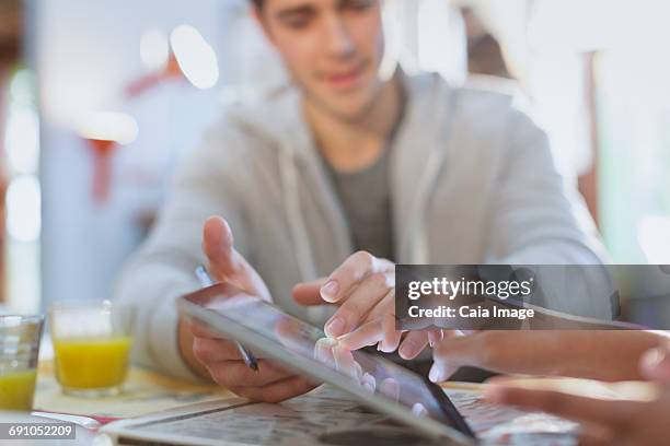 young man touching using digital tablet - drinking buddies film bildbanksfoton och bilder