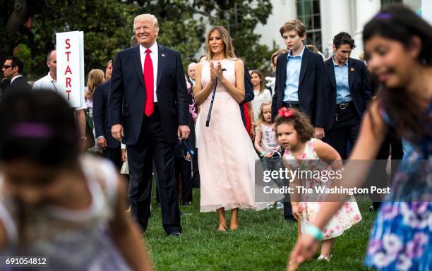 President Donald Trump and First Lady Melania Trump blow the whistle to begin an Easter egg roll at the 139th White House Easter Egg Roll on the...