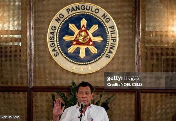 Philippine President Rodrigo Duterte officiates a mass oath taking of officials of various national leagues at the Malacanang Palace in Manila on...