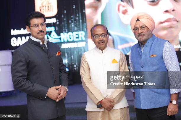 Minister of State for Information & Broadcasting Rajyavardhan Singh Rathore, Sports Minister Vijay Goel and FDCI President Sunil Sethi during the...