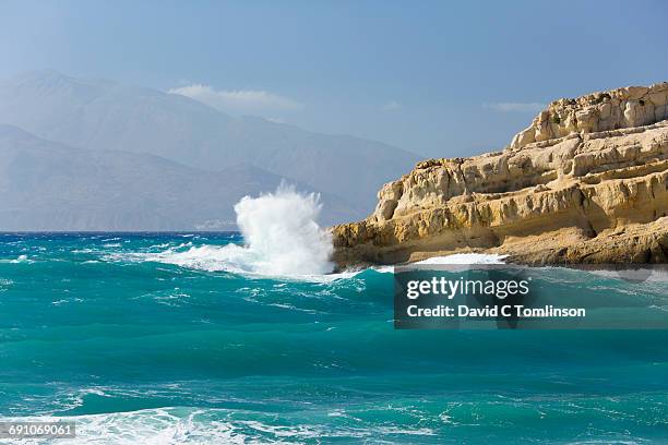 rough sea battering headland, matala, crete - littoral rocheux photos et images de collection