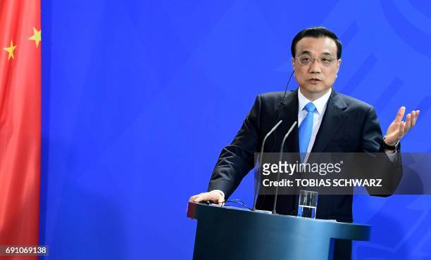 Chinese Prime Minister Li Keqiang gives a joint press conference with the German Chancellor after representatives of both countries signed economic...