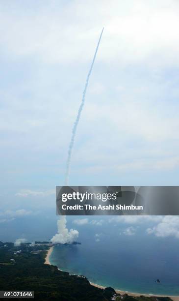 In this aerial image, H-IIA F34 carrying the Quasi-Zenith Satellite Michibiki No.2 lifts off from the Japan Aerospacec Exploration Agency Tanegashima...