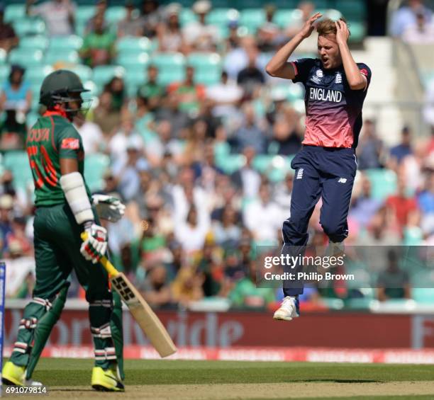 Jake Ball of England reacts after Soumya Sarkar of Bangladesh was dropped by Moeen Ali during the ICC Champions Trophy match between England and...