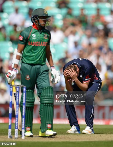 Jake Ball of England reacts after Soumya Sarkar of Bangladesh was dropped by Moeen Ali during the ICC Champions Trophy match between England and...