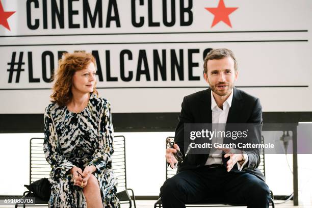 Susan Sarandon and L'Oreal Global President Pierre Emmanuel Angeloglou are photographed the L'Oreal Paris Beach Studio during the 70th annual Cannes...