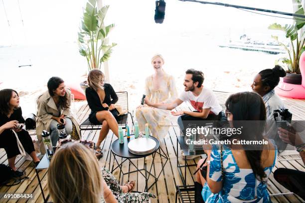 Elle Fanning is photographed at the L'Oreal Paris Beach Studio during the 70th annual Cannes Film Festival on May 19, 2017 in Cannes, France.