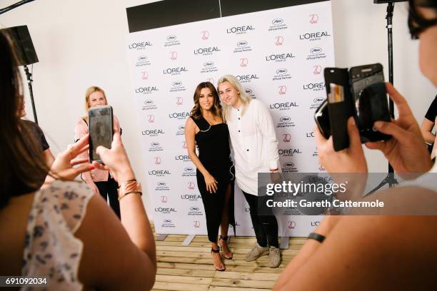 Eva Longoria meets fans at the L'Oreal Paris Beach Studio during the 70th annual Cannes Film Festival on May 21, 2017 in Cannes, France.