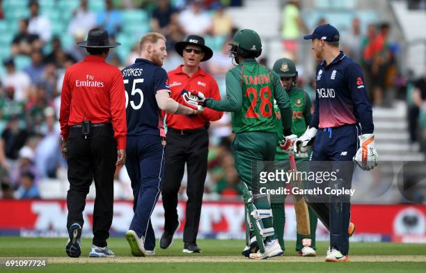 Ben Stokes of England and Tamin Iqbal of Bangladesh exchange words during the ICC Champions Trophy group match between England and Bangladesh at The...