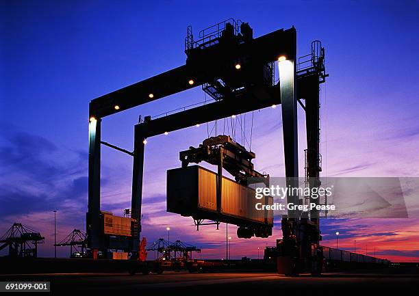freight train being loaded, dusk - 貨物列車 ストックフォトと画像