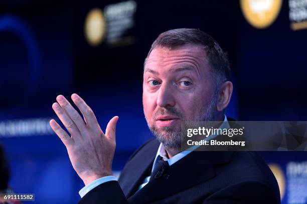 Oleg Deripaska, Russian billionaire and president of United Co. Rusal, gestures as he speaks on the Bloomberg Television debate panel during the St....