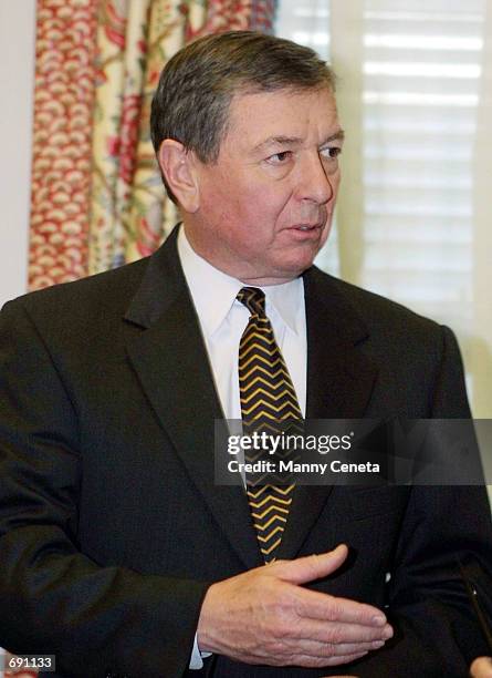 Attorney General John Ashcroft gestures during a reception at the Justice Department building January 15, 2002 in Washington, DC. The Bush...