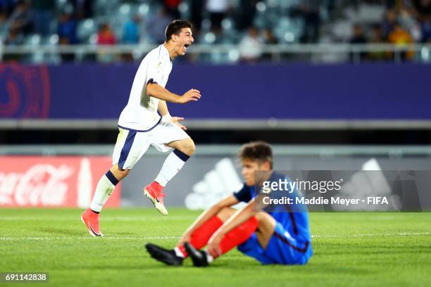 Riccardo Orsolini of Italy celebrates in front of Amine Harit of France after Italy defeat France 2-1 during the FIFA U-20 World Cup Korea Republic...