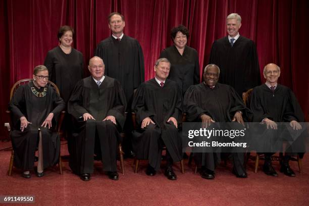 Justices of the U.S. Supreme Court pose for a formal group photograph in the East Conference Room of the Supreme Court in Washington, D.C., U.S., on...