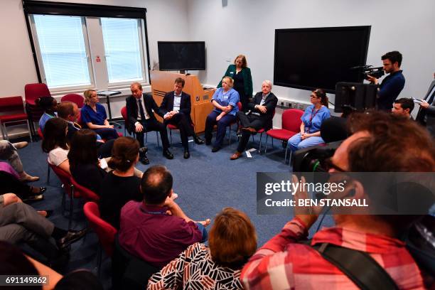 Liberal Democrat candidate for Sheffield Hallam and former party leader Nick Clegg and Liberal Democrat leader Tim Farron speak to staff at a Brexit...