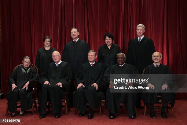 Front row from left, U.S. Supreme Court Associate Justice Ruth Bader Ginsburg, Associate Justice Anthony M. Kennedy, Chief Justice John G. Roberts,...