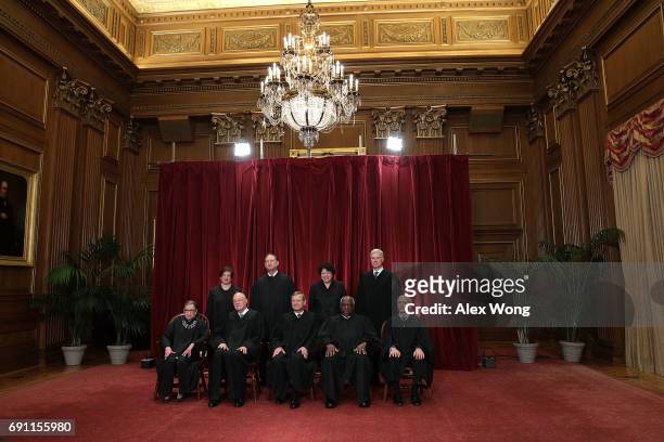 Front row from left, U.S. Supreme Court Associate Justice Ruth Bader Ginsburg, Associate Justice Anthony M. Kennedy, Chief Justice John G. Roberts,...