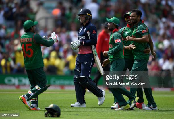 Jason Roy of England leaves the field after being dismissed by Mashrafe Mortaza of Bangladesh during the ICC Champions Trophy group match between...
