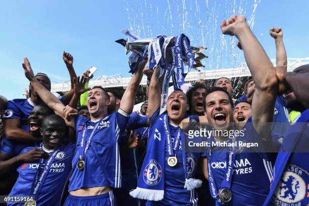 Ngolo Kante, Gary Cahill, John Terry and Cesar Azpilicueta of Chelsea celebrates with the Premier League Trophy after the Premier League match...