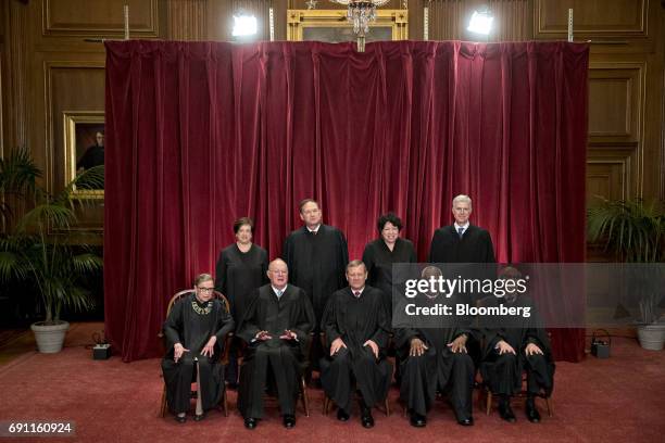 Justices of the U.S. Supreme Court pose during their formal group photograph in the East Conference Room of the Supreme Court in Washington, D.C.,...