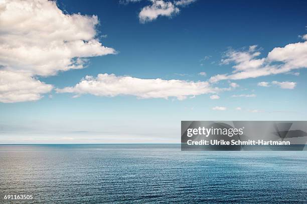 surface of calm sea on a sunny day - sea horizon stock pictures, royalty-free photos & images