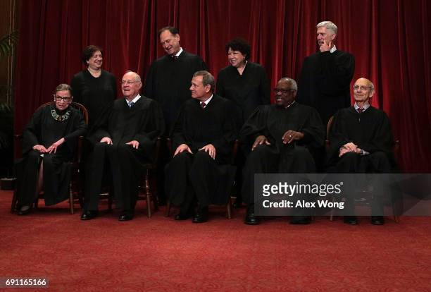 Front row from left, U.S. Supreme Court Associate Justice Ruth Bader Ginsburg, Associate Justice Anthony M. Kennedy, Chief Justice John G. Roberts,...
