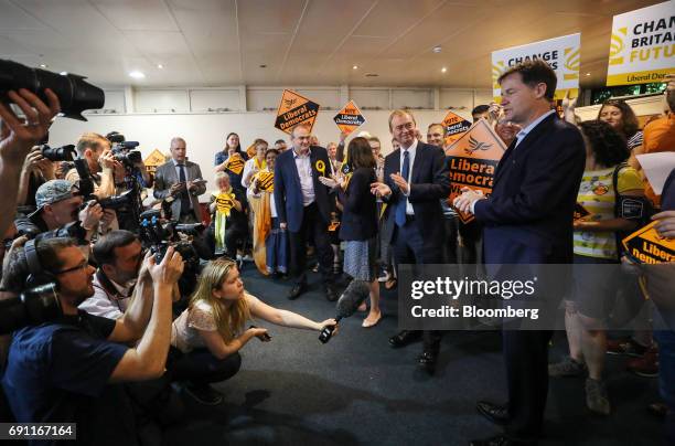 Tim Farron, leader of the Liberal Democrats, center, listens to Nick Clegg, former leader of the Liberal Democrats, right, during a general-election...