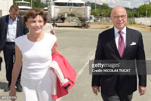 French former prime minister and member of the socialist party Bernard Cazeneuve reacts during a support visit to the party's candidate for the...