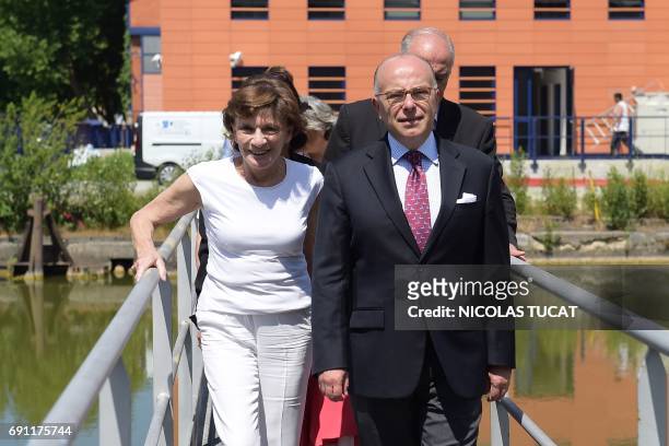 French former prime minister and member of the socialist party Bernard Cazeneuve reacts during a support visit to the party's candidate for the...