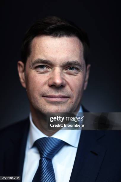 Alexey Mordashov, billionaire and chairman of Severstal PAO, poses for a photograph following a Bloomberg Television interview and during the St....