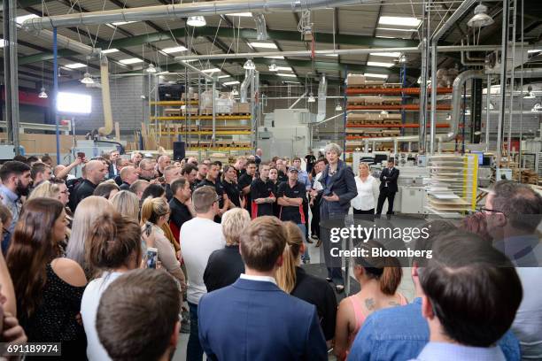 Theresa May, U.K. Prime minister and leader of the Conservative Party, speaks to workers during a general-election campaign tour stop at Ultima...