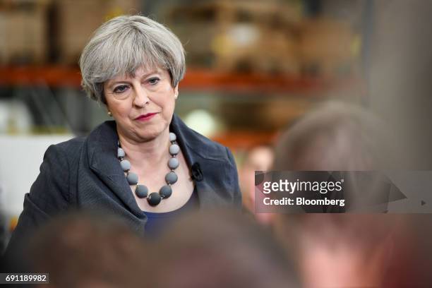 Theresa May, U.K. Prime minister and leader of the Conservative Party, speaks to workers during a general-election campaign tour stop at Ultima...