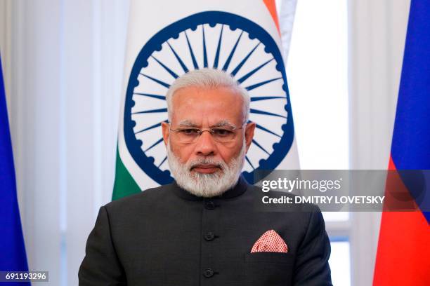 Indian Prime Minister Narendra Modi attends a signing ceremony following a meeting with Russian President on the sidelines of the St. Petersburg...