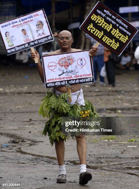 Supporter of bahujan samaj party holding placards protesting against the current government for fuel rates inflation on friday at azad maidan.