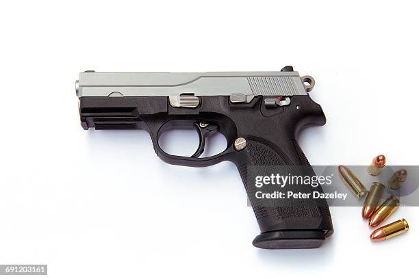 hand gun with rounds - gun stock pictures, royalty-free photos & images