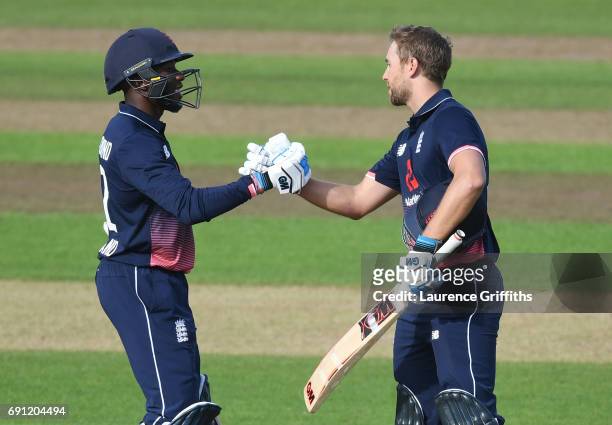 Daniel Bell-Drummond of England Lions congratulates Dawid Malan on reaching his century during the One Day International match between England Lions...