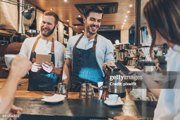 modern technology in the coffee shop - rfid technology stock pictures, royalty-free photos & images