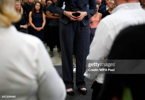 Britain's Prime Minister Theresa May's hands are shown in detail as she gestures during an election campaign event at Ultima Furniture on June 1,...