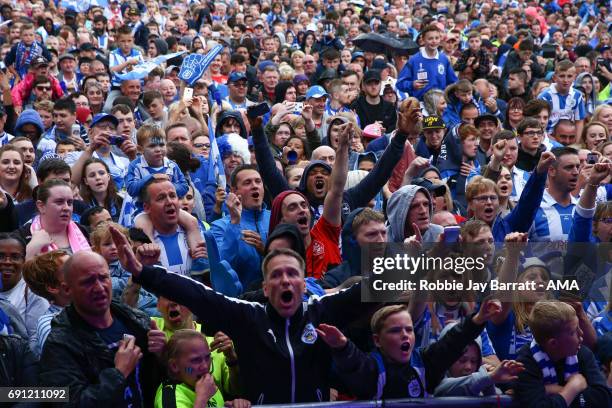 Huddersfield Town fans wait for the open top bus to arrive on May 30, 2017 in Huddersfield, England.