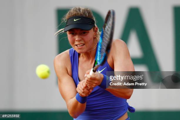 Carina Witthoeft of Germany hits a backhand during the ladies singles second round match against Pauline Parmentier of France on day five of the 2017...
