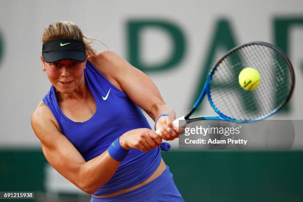 Carina Witthoeft of Germany hits a backhand during the ladies singles second round match against Pauline Parmentier of France on day five of the 2017...