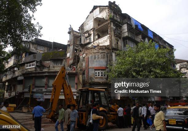 Part of Ramchandra Building collapsed on Sunday night opposite Gokuldas Tejpal Hospital on Lokmanya Tilak Marg, near Metro Theatre junction.