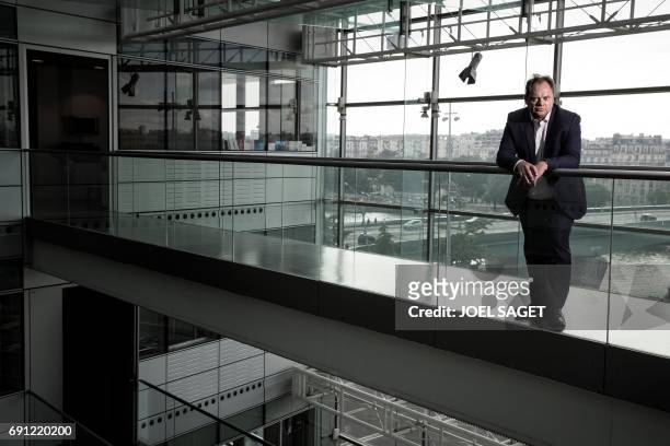 Newly appointed news director of the French state-run television group "France Televisions" Yannick Letranchant, poses during a photo session on May...