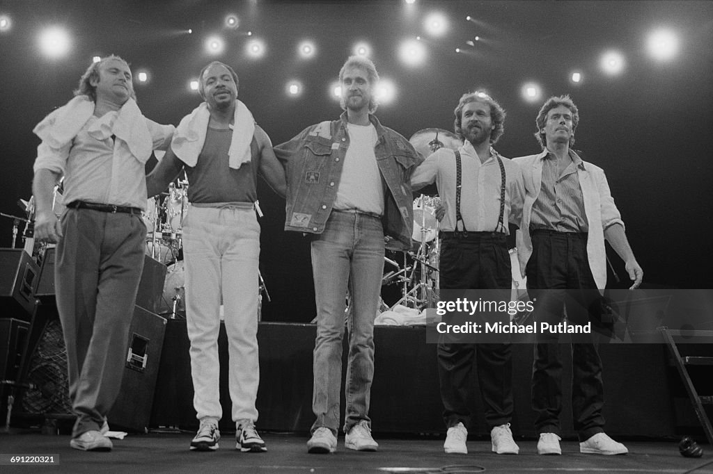 Michael Rutherford Invisible Touch Rock group Genesis on stage at the end of a concert at the Rosemont ...